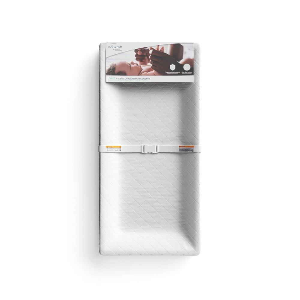 imageStorkcraft Nest 4Sided Contoured Baby Changing Pad with Safety Strap GREENGUARD Gold Certified WaterResistant Surface Fits Most StandardSize Changing Table Toppers NonSkid Bottom